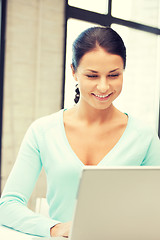 Image showing happy woman with laptop computer