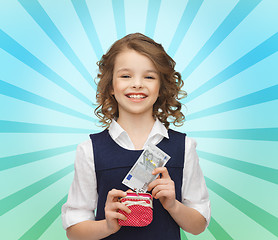 Image showing happy girl with purse and paper money