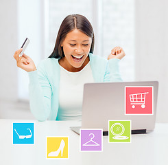 Image showing happy businesswoman with laptop and credit card