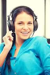 Image showing happy teenage girl in big headphones