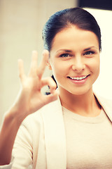 Image showing lovely teenage girl showing ok sign