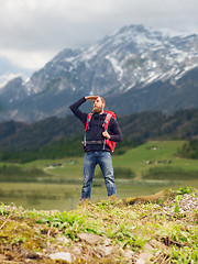 Image showing tourist with beard and backpack looking far away