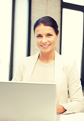 Image showing happy woman with laptop computer