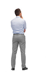 Image showing businessman thinking from back