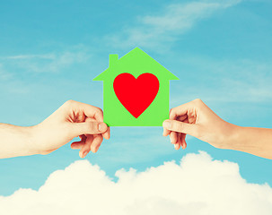 Image showing couple hands holding green paper house