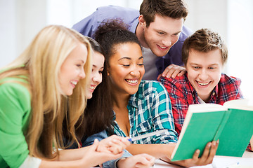 Image showing students reading book at school