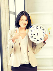 Image showing businesswoman with clock