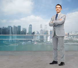 Image showing happy smiling businessman in suit