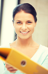 Image showing woman with folder