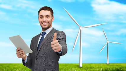 Image showing smiling businessman with tablet pc computer