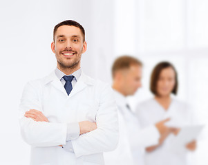 Image showing smiling male doctor in white coat