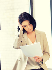 Image showing calm woman with documents