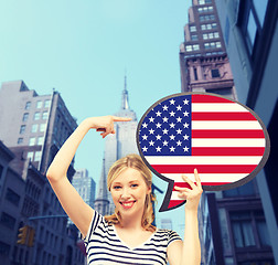 Image showing smiling woman with text bubble of american flag