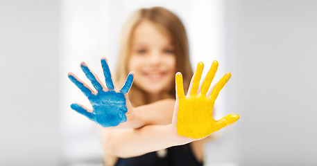 Image showing girl showing painted hands