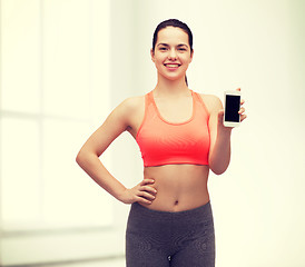 Image showing sporty woman with smartphone