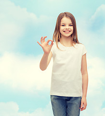 Image showing little girl in white t-shirt showing ok gesture