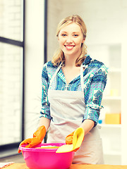 Image showing housewife washing dish at the kitchen