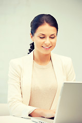 Image showing happy woman with laptop computer