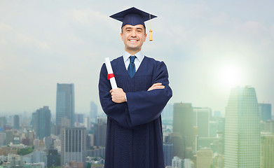 Image showing smiling adult student in mortarboard with diploma