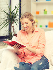 Image showing happy and smiling woman with book