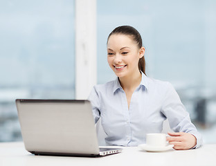 Image showing smiling businesswoman or student with laptop