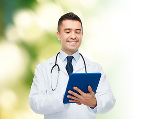 Image showing smiling male doctor in white coat with tablet pc