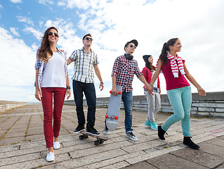 Image showing teenagers with skates outside