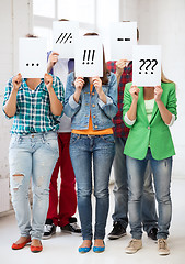 Image showing friends or students covering faces with papers