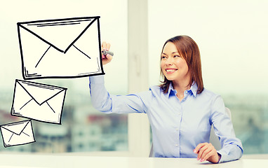 Image showing businesswoman drawing envelope