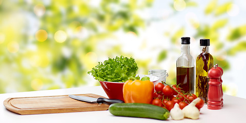 Image showing vegetables, spices and kitchenware on table