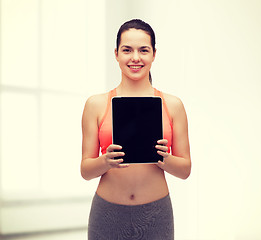 Image showing sporty woman with tablet pc blank screen