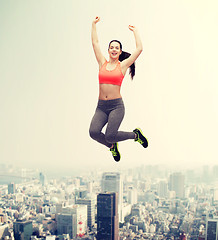 Image showing sporty teenage girl jumping in sportswear