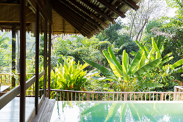 Image showing swimming pool and bungalow at hotel resort