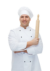 Image showing happy male chef cook holding rolling pin