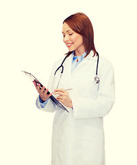 Image showing smiling female doctor with clipboard