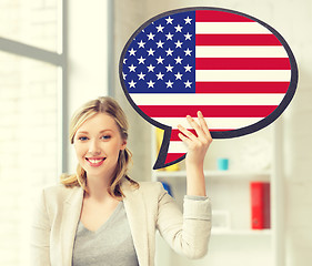 Image showing smiling woman with text bubble of american flag