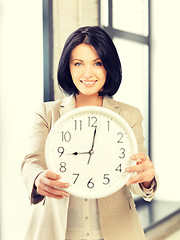 Image showing businesswoman with clock
