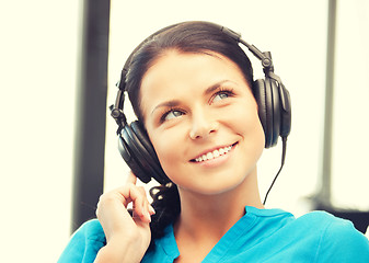 Image showing happy teenage girl in big headphones