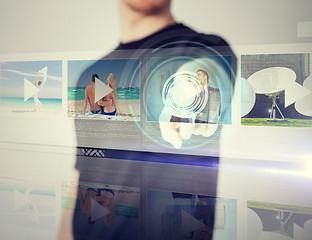 Image showing man pressing button on virtual screen