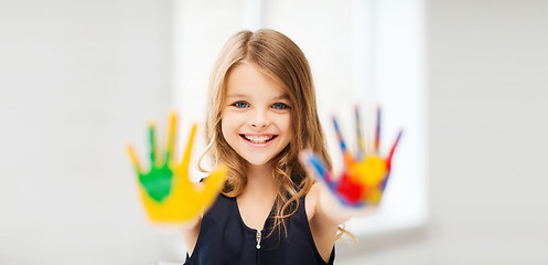 Image showing smiling girl showing painted hands