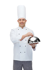 Image showing happy male chef cook holding cloche