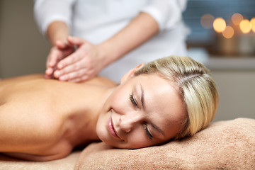 Image showing close up of woman lying and having massage in spa