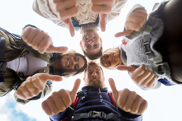 Image showing group of smiling friends with backpacks hiking