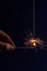 Image showing Hand lighting a sparkler