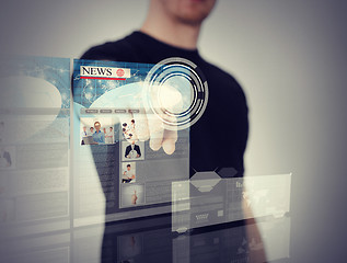 Image showing man pressing button on virtual screen
