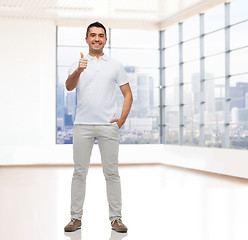 Image showing smiling man showing thumbs up