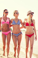 Image showing group of smiling young women on beach