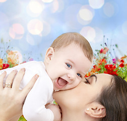 Image showing happy mother with baby over natural background