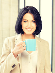 Image showing lovely businesswoman with mug