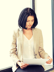 Image showing calm woman with documents